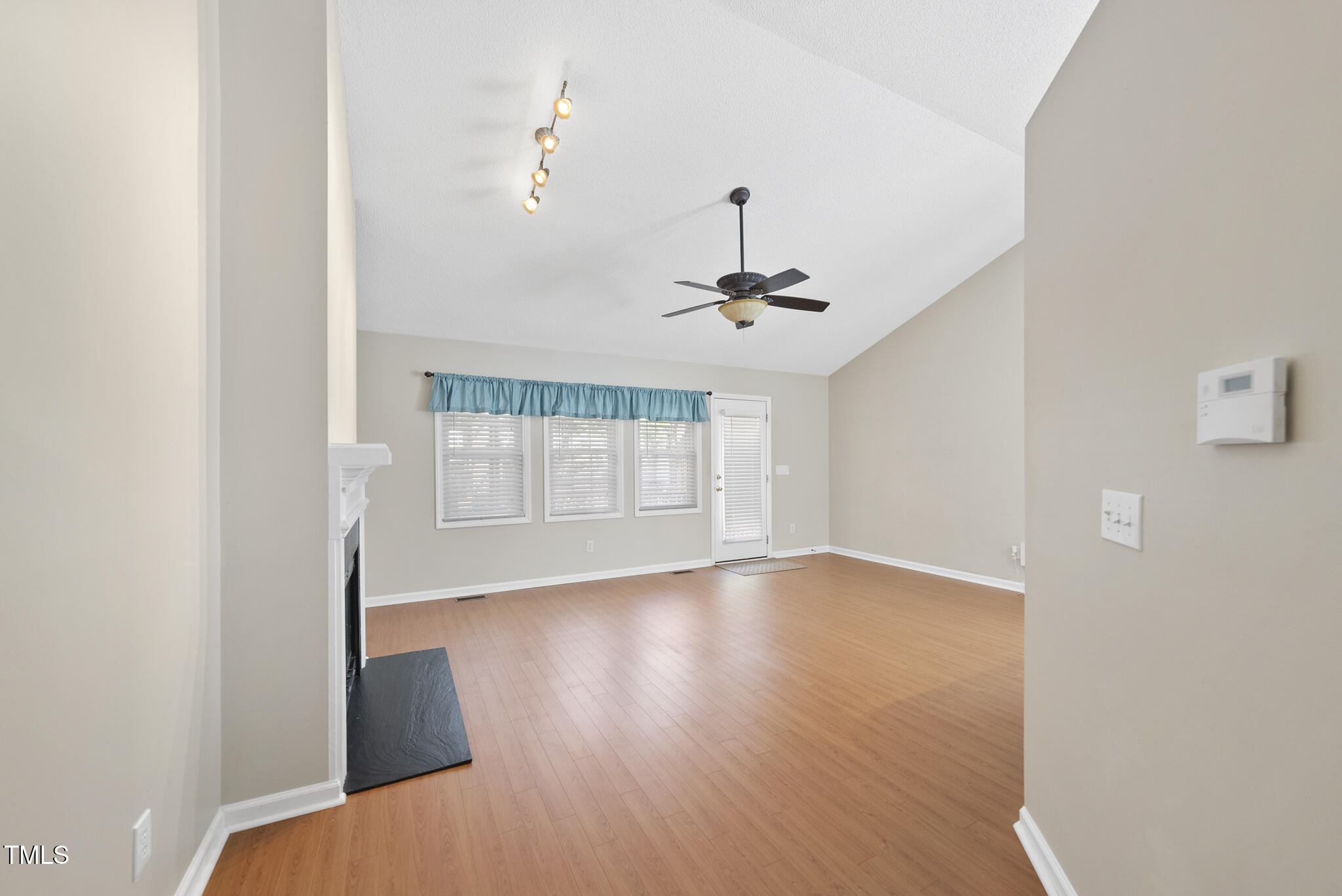 3519 Streams Of Fields Drive Raleigh, NC 27604 - Photo 3 of 20 a view of empty room with wooden floor and fan