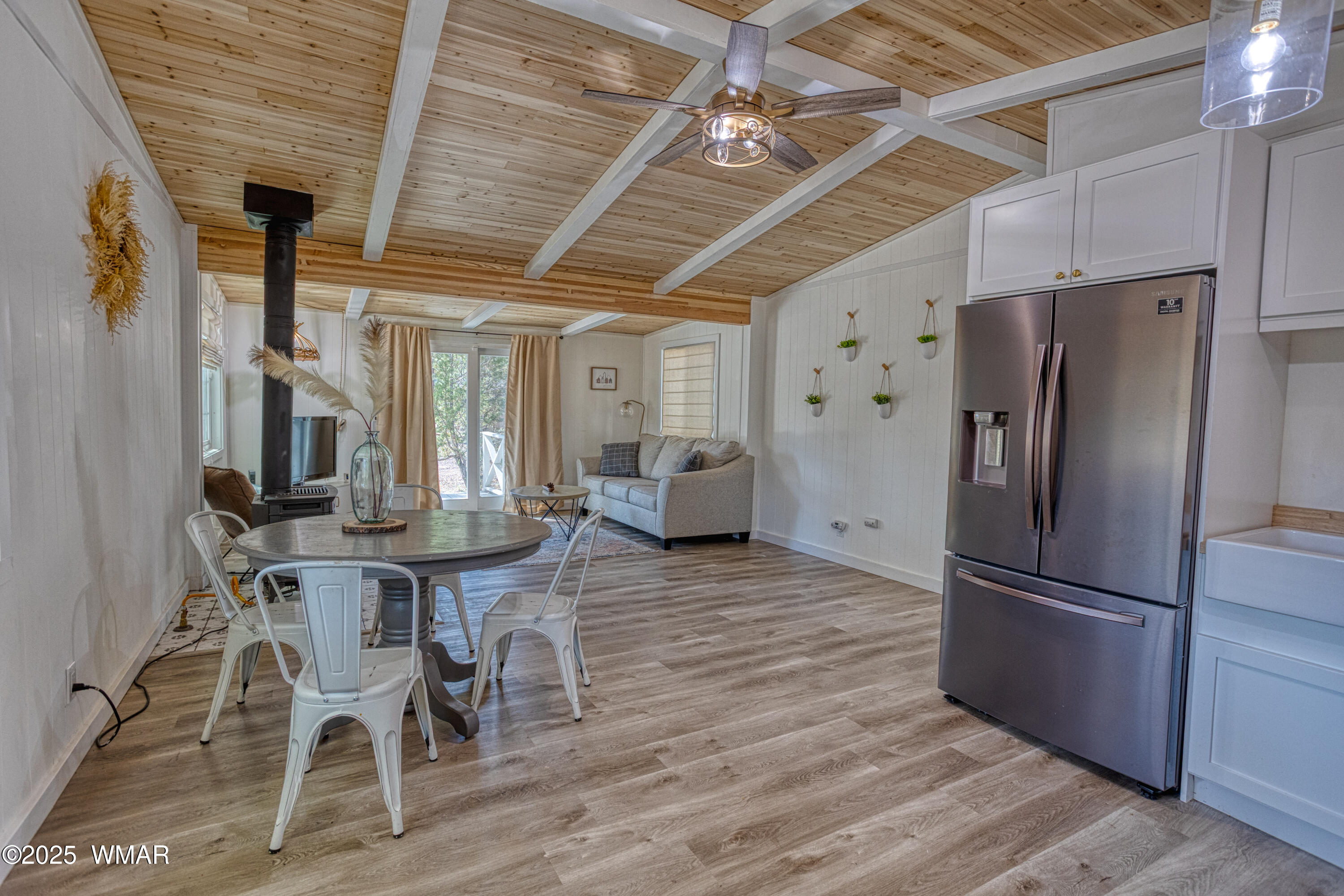 2905 Pine Rim Road Overgaard, AZ 85933 - Photo 8 of 19 a kitchen with stainless steel appliances a refrigerator and wooden floor