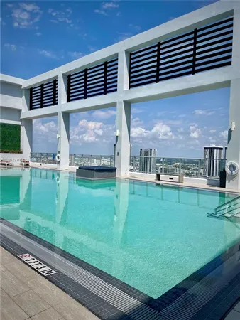 a view of a backyard with table and chairs