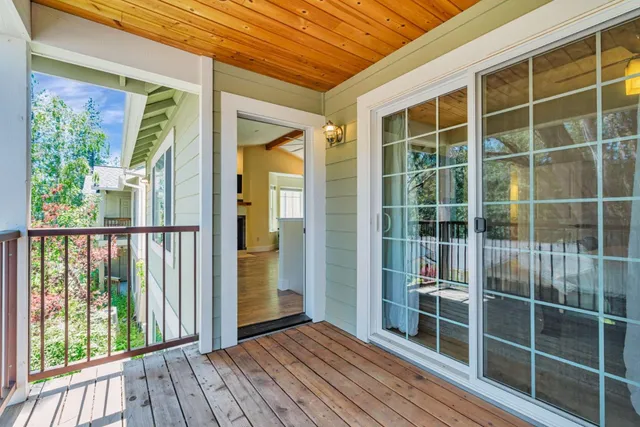a view of balcony with wooden floor