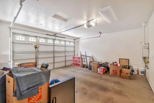 a front view of a house with a garden and plants