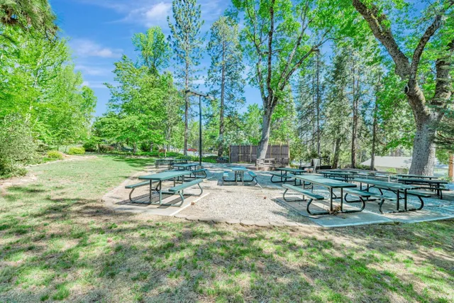 a view of a backyard with swimming pool