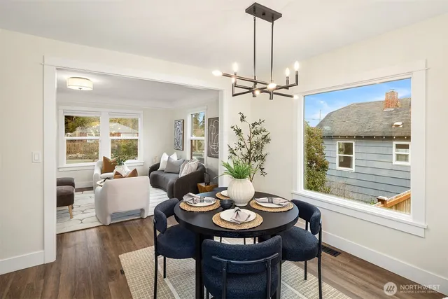 a view of a dining room with furniture window and wooden floor