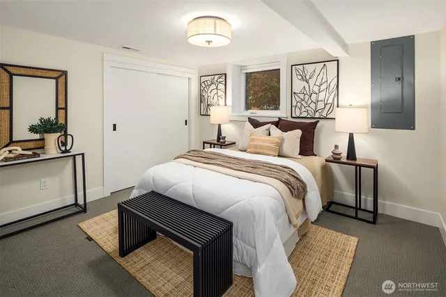 a bedroom with a bed and a dresser