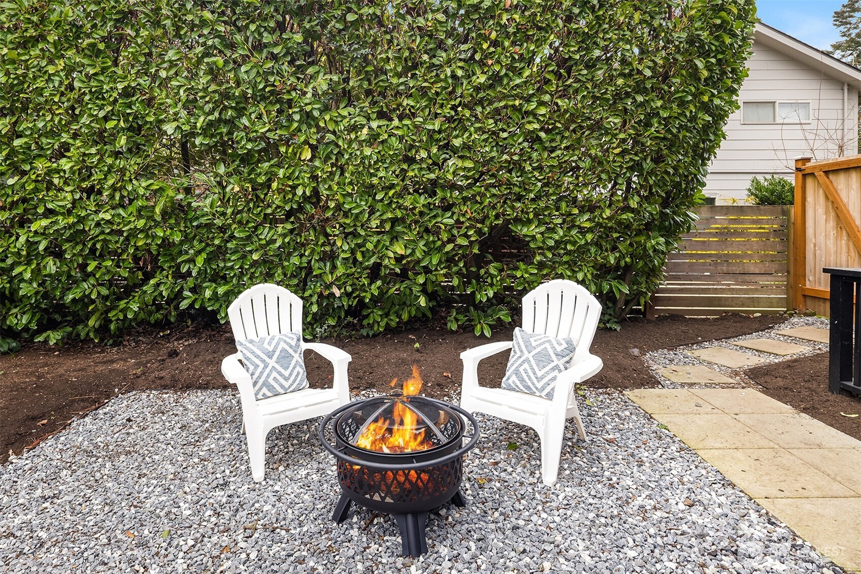 721 North 97th Street Seattle, WA 98103 - Photo 28 of 35 a view of a wooden chairs and bench in the patio