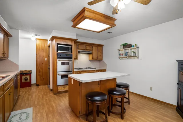 a room with furniture and wooden floor