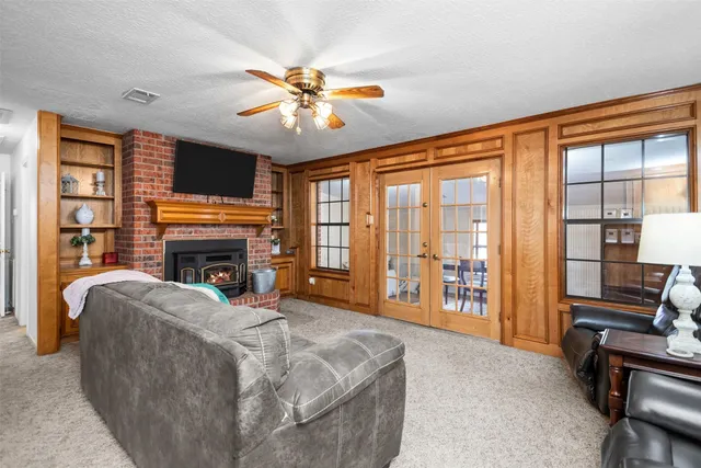 a bed room with a bed and a fireplace