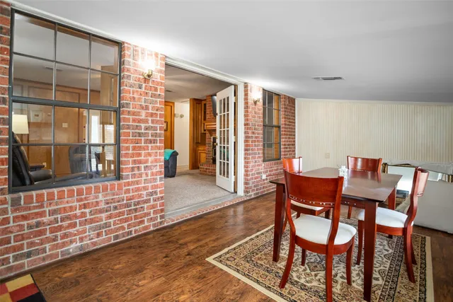 a view of a dining room with furniture and window