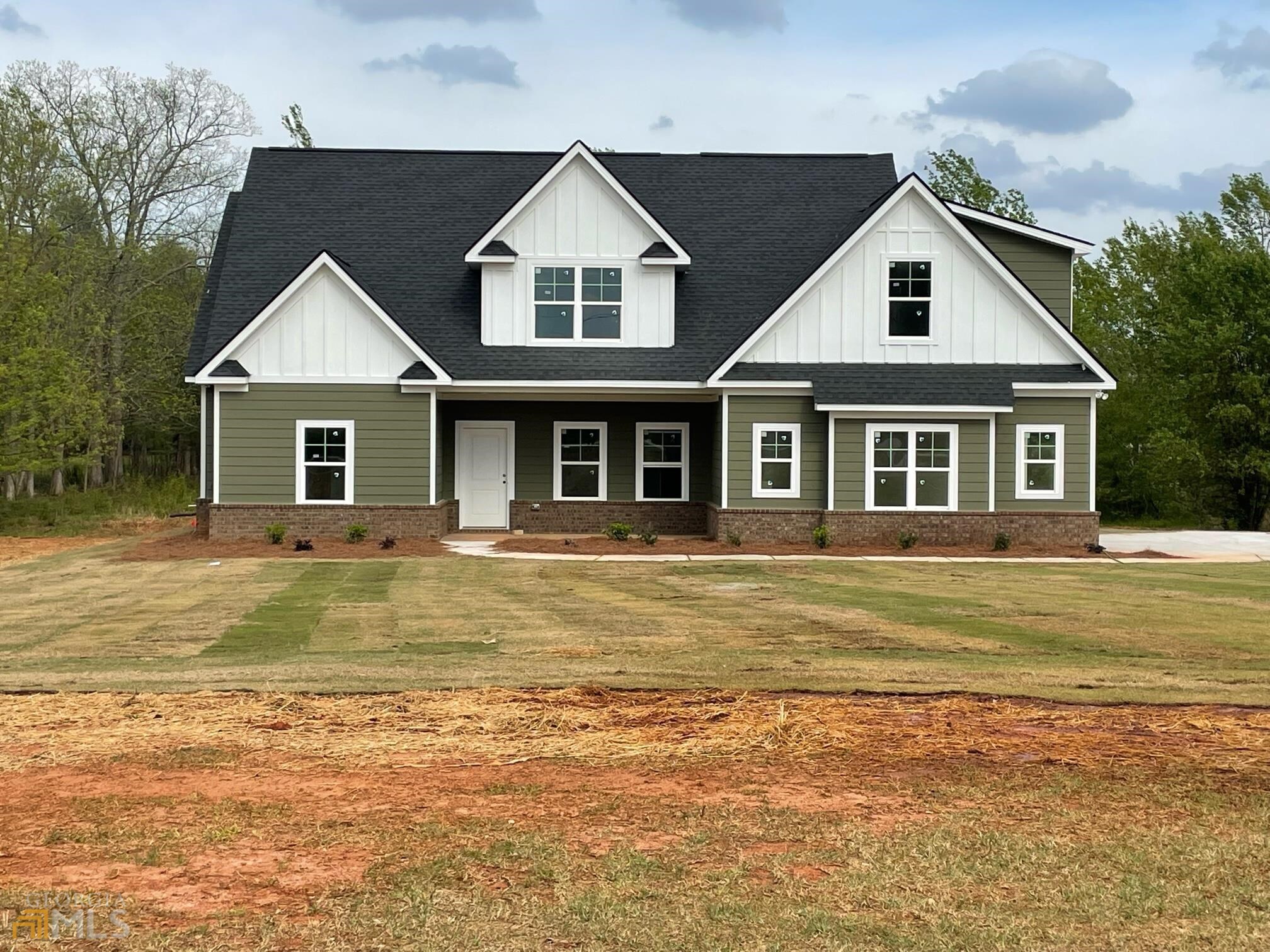 2201 High Falls Road Jackson, GA 30233 - Photo 1 of 1 a front view of a house with a garden