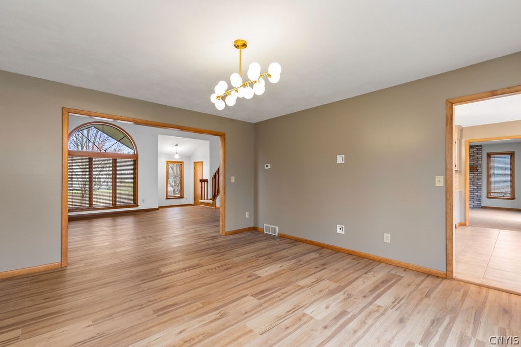 3293 Greenleafe Drive Lysander, NY 13135 - Photo 14 of 40 Formal dining room is flanked by the kitchen and t