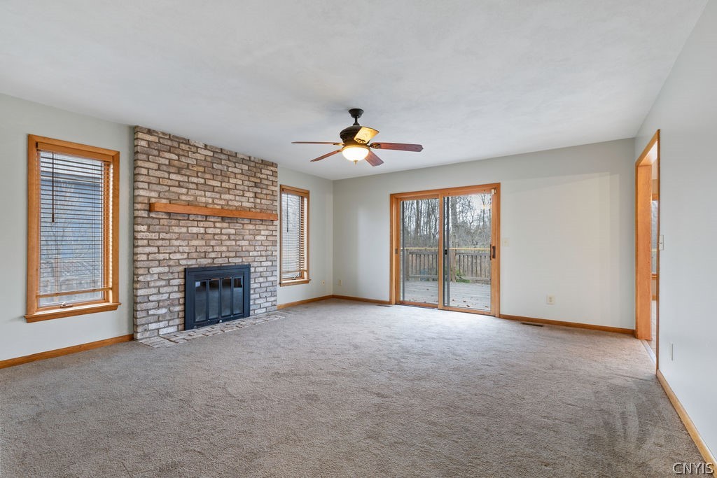 3293 Greenleafe Drive Lysander, NY 13135 - Photo 16 of 40 Family room with gas fireplace offering both addit
