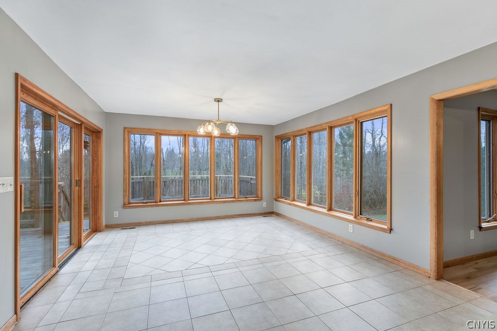 3293 Greenleafe Drive Lysander, NY 13135 - Photo 7 of 40 Full window breakfast room opens to a large deck