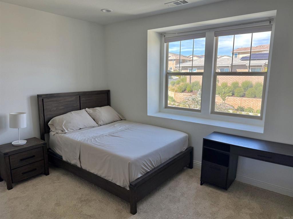 39529 Dayspring Way Temecula, CA 92591 - Photo 33 of 49 a bedroom with a bed and a window