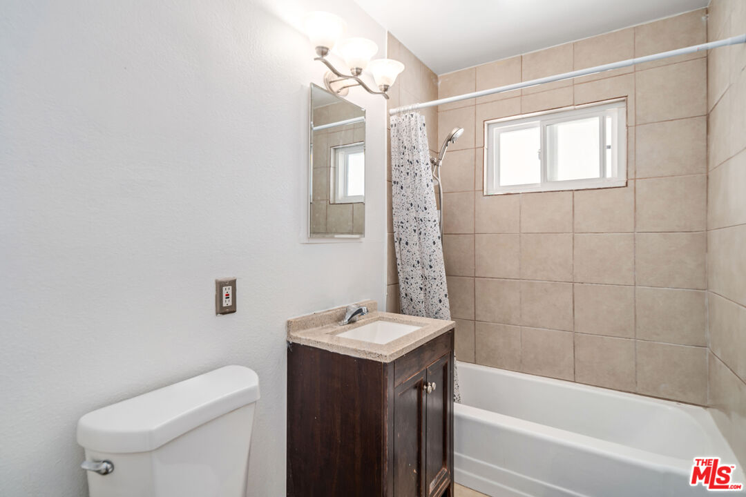 15872 Rexroth Drive Mojave, CA 93501 - Photo 11 of 20 a bathroom with a sink a toilet and bathtub