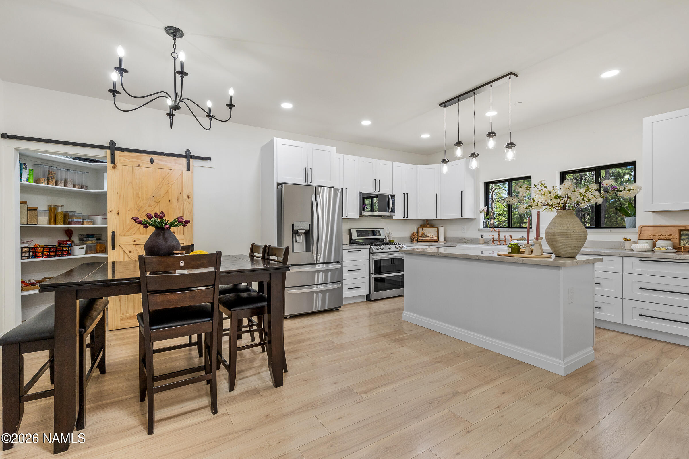 1113 Redwall Way Williams, AZ 86046 - Photo 12 of 53 a large kitchen with a table and chairs