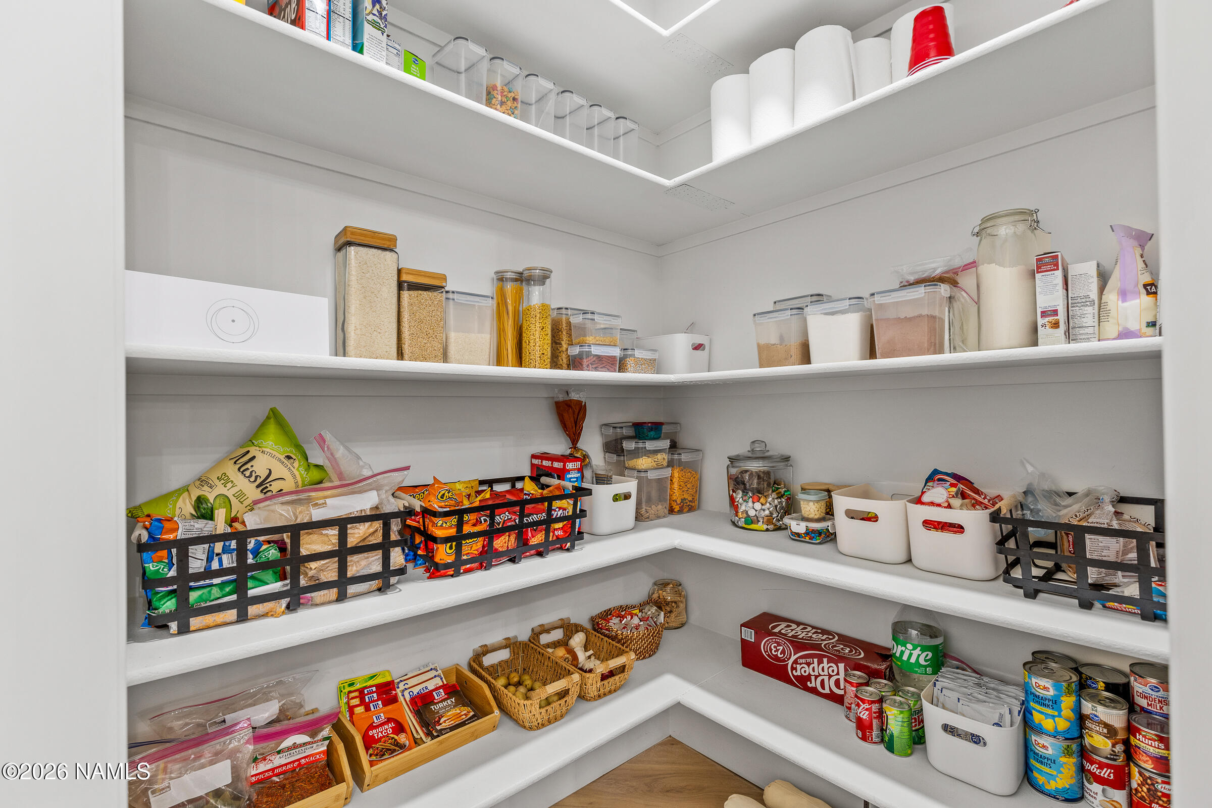 1113 Redwall Way Williams, AZ 86046 - Photo 14 of 53 a cabinet with painting on the wall and shelf