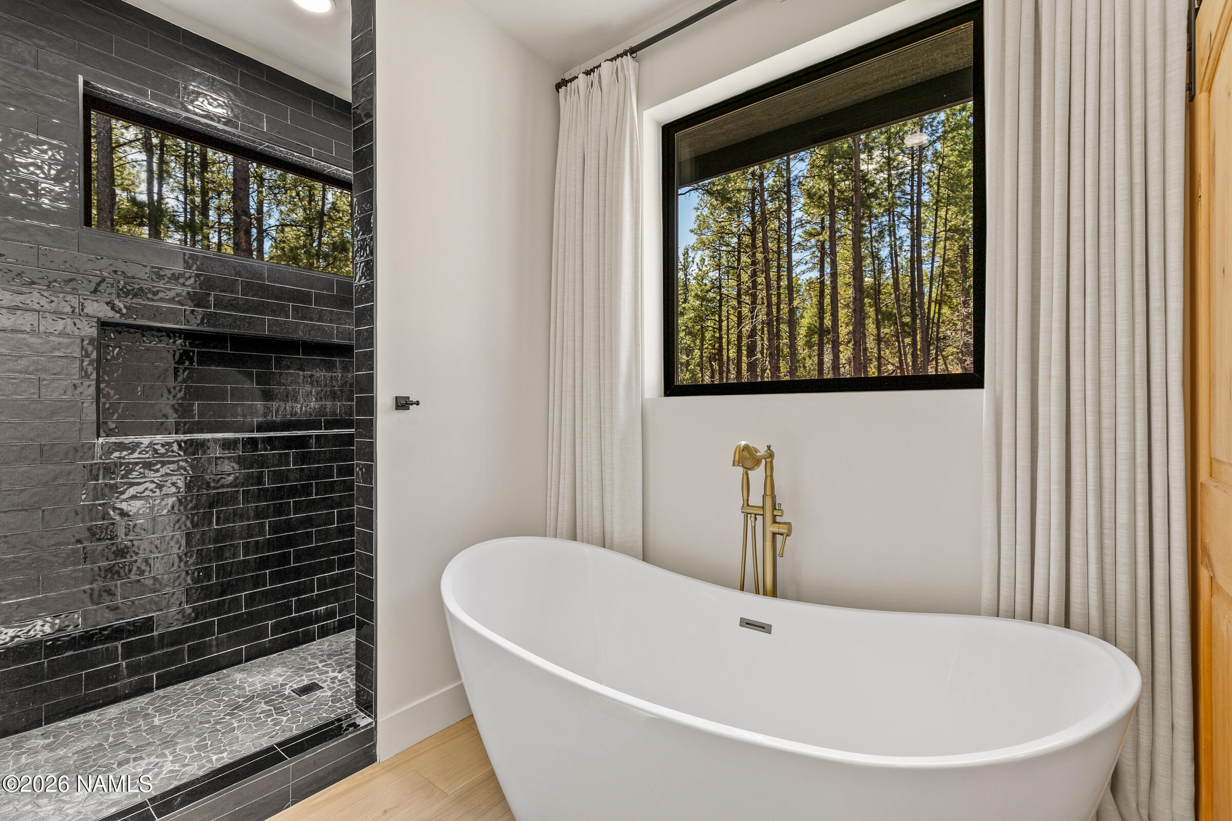 1113 Redwall Way Williams, AZ 86046 - Photo 21 of 53 a white bath tub sitting next to a window