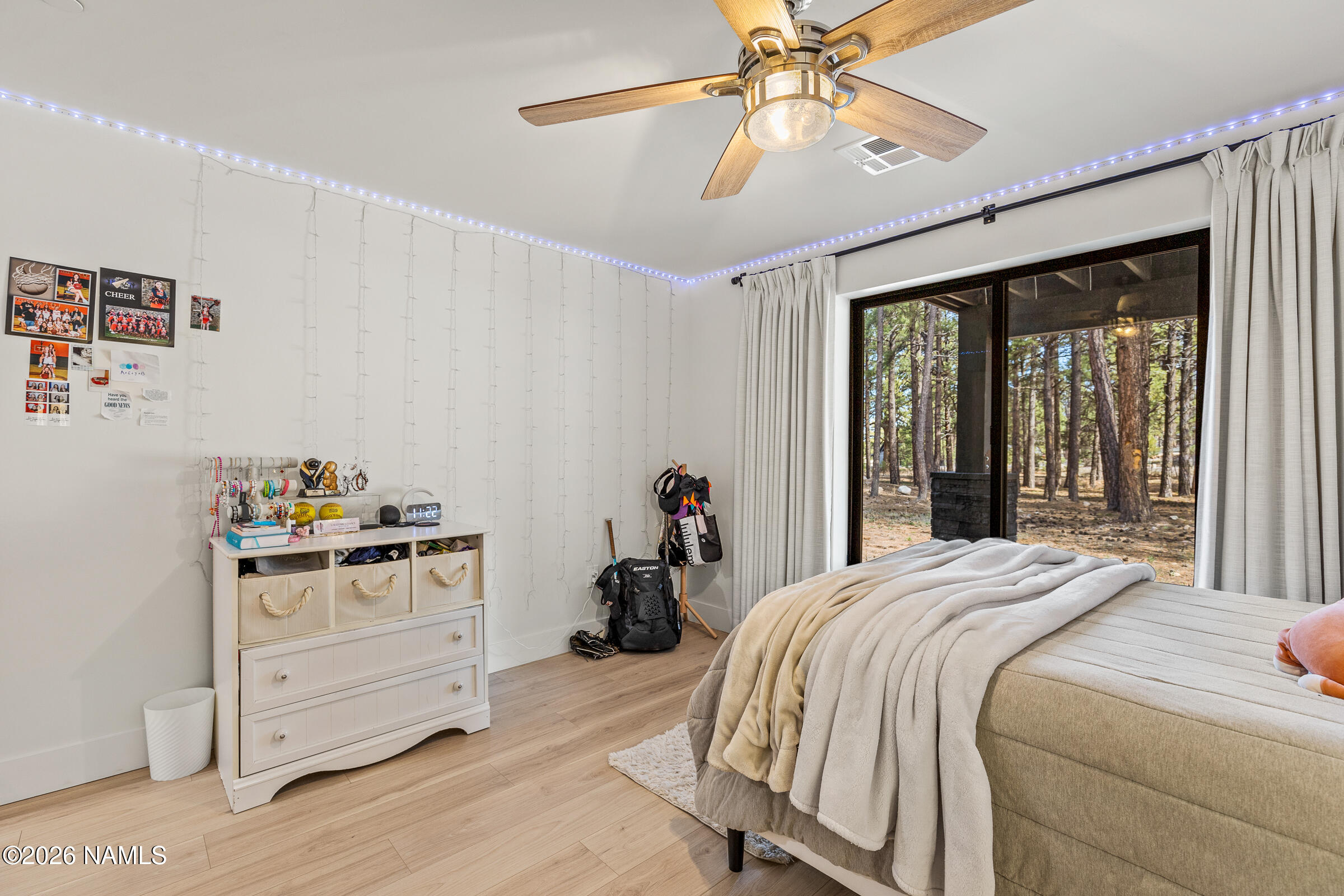 1113 Redwall Way Williams, AZ 86046 - Photo 30 of 53 a bedroom with a bed and a chandelier