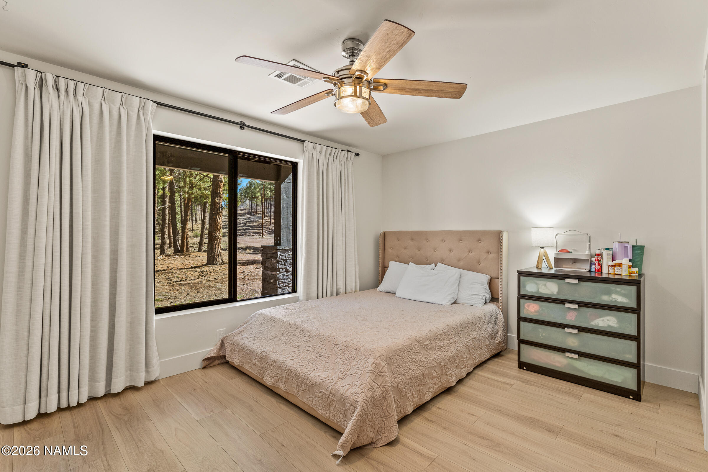 1113 Redwall Way Williams, AZ 86046 - Photo 31 of 53 a bedroom with a bed and a large window