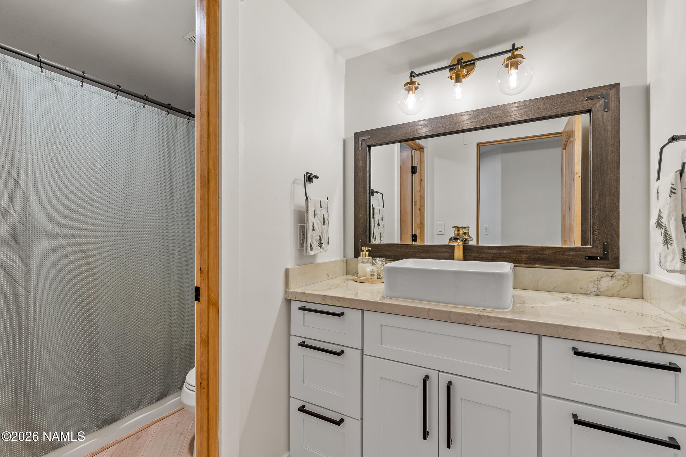 1113 Redwall Way Williams, AZ 86046 - Photo 34 of 53 a bathroom with a granite countertop sink and a mirror