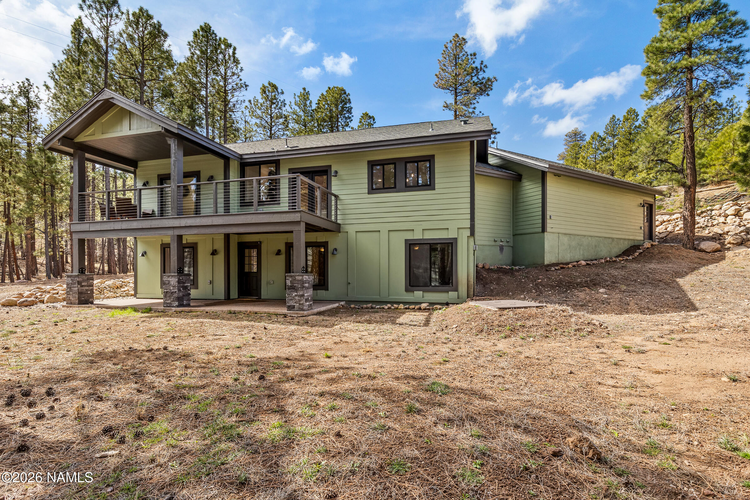 1113 Redwall Way Williams, AZ 86046 - Photo 46 of 53 a front view of a house with a yard and garage