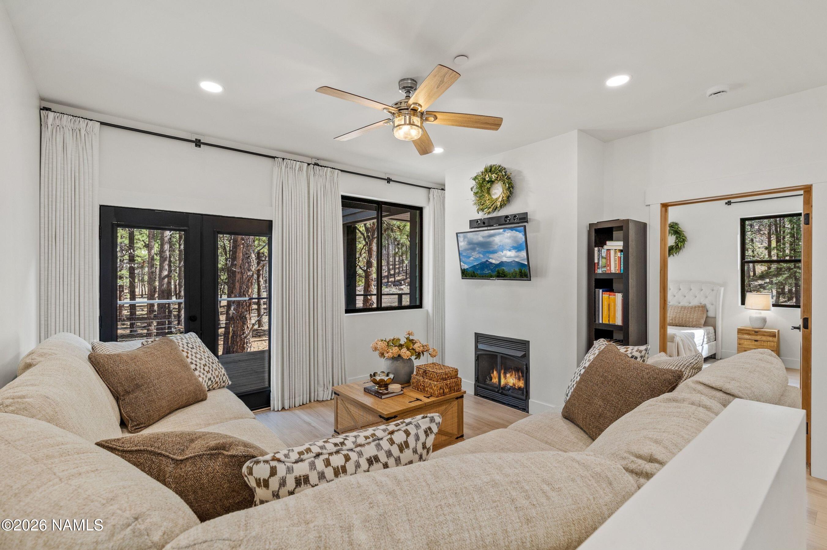 1113 Redwall Way Williams, AZ 86046 - Photo 8 of 53 a living room with fireplace furniture and a window