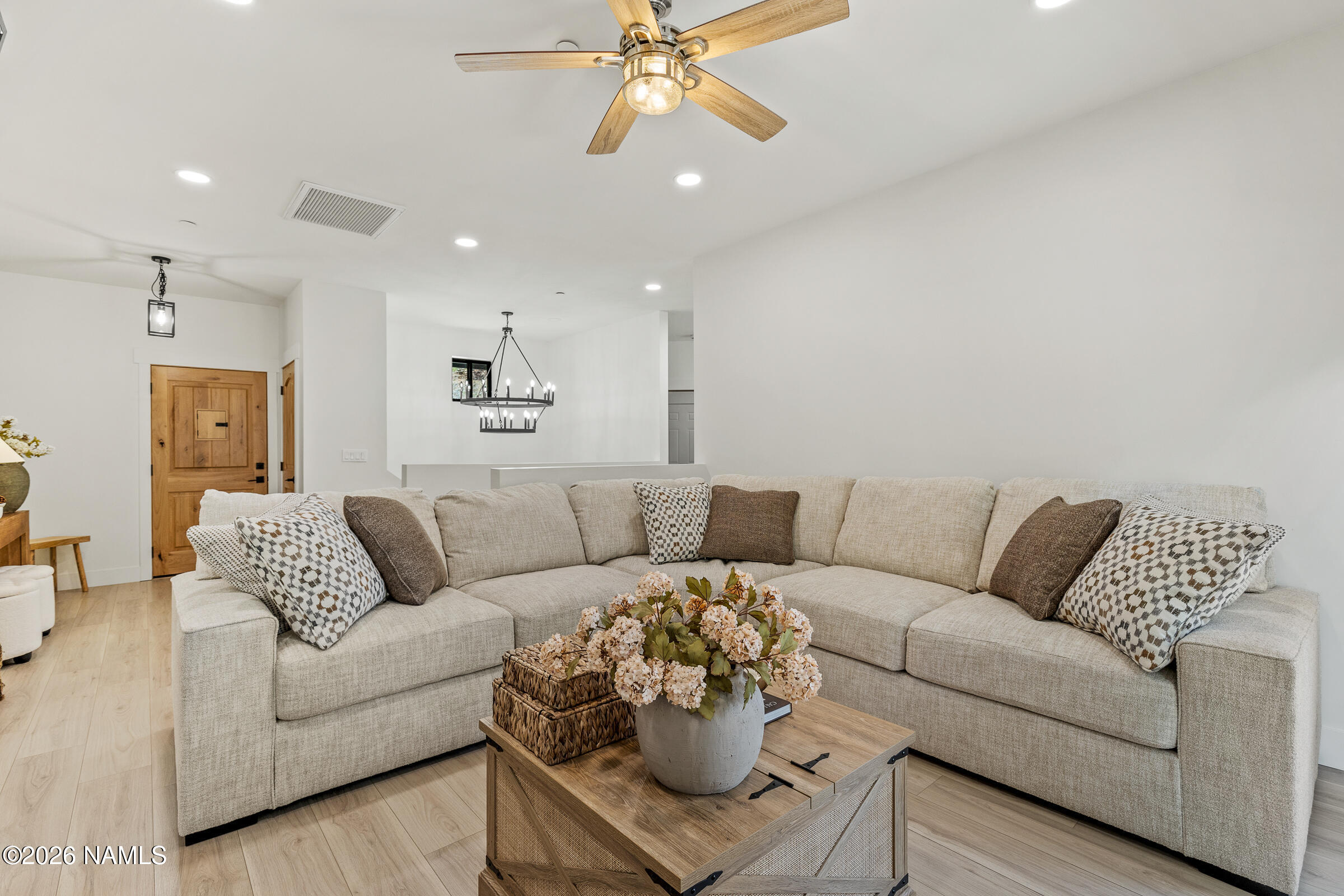 1113 Redwall Way Williams, AZ 86046 - Photo 9 of 53 a living room with furniture and a chandelier
