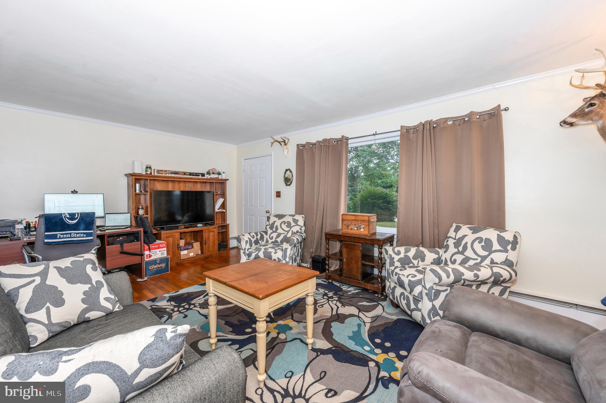 4828 Ridge Road Mount Airy, MD 21771 - Photo 5 of 33 a living room with furniture a flat screen tv and a window