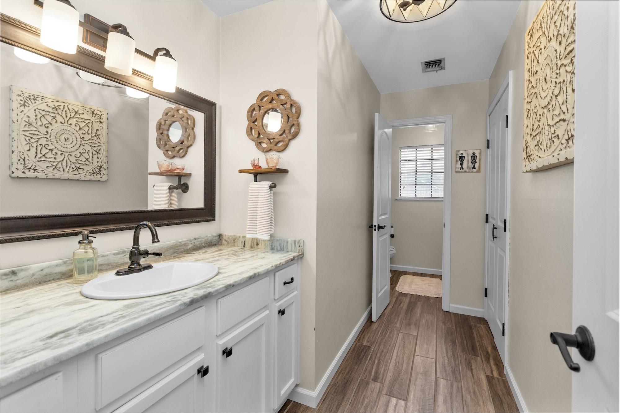 21251 Old River Road Washington, TX 77880 - Photo 12 of 20 a bathroom with a sink and a mirror