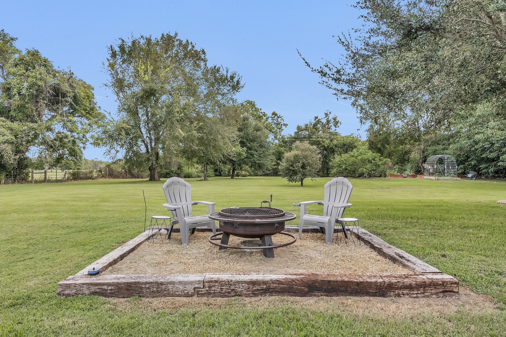 21251 Old River Road Washington, TX 77880 - Photo 16 of 20 a view of a lake with a table and chair in the patio