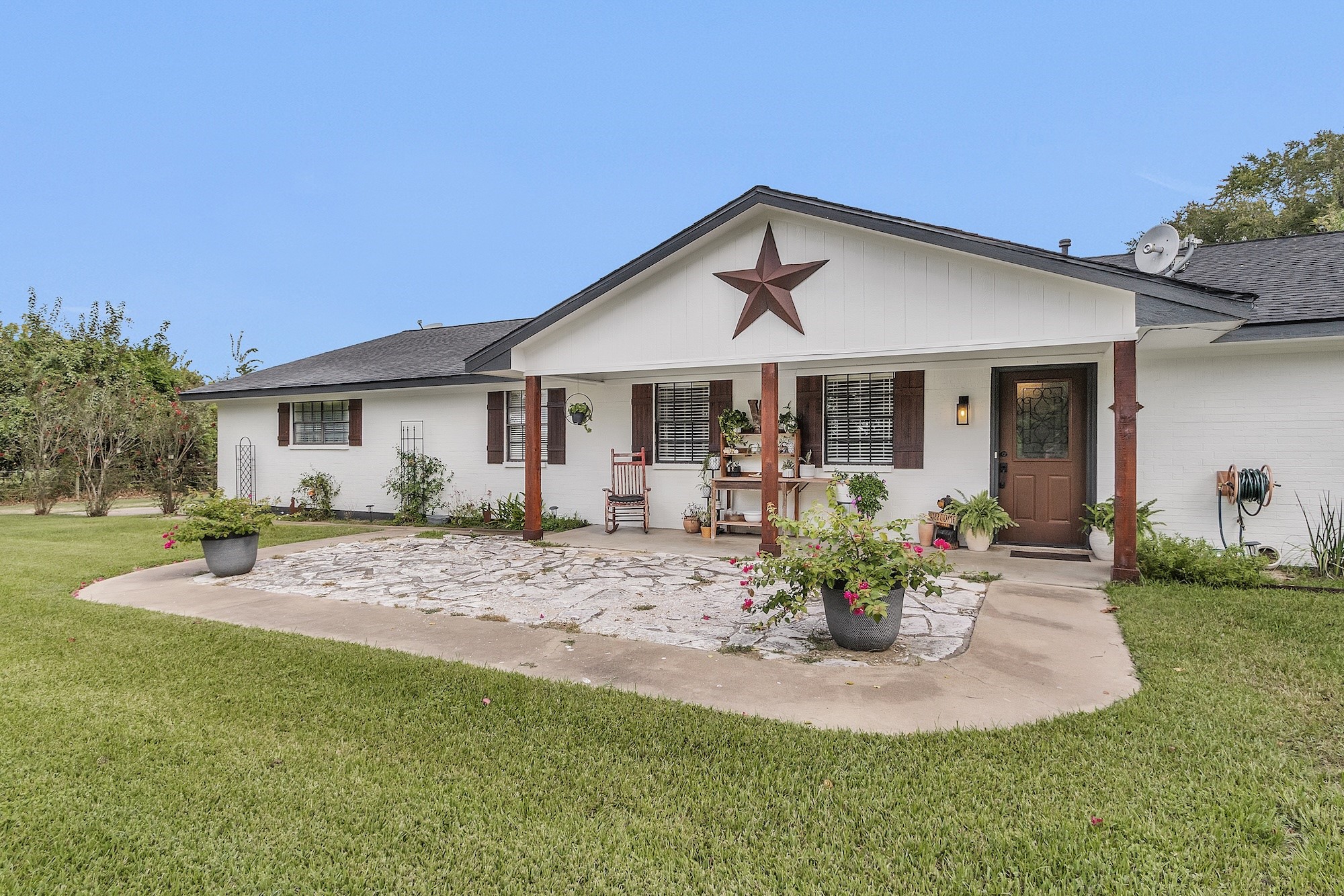21251 Old River Road Washington, TX 77880 - Photo 2 of 20 a view of a house with table and chairs in patio