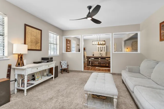 a living room with furniture and windows