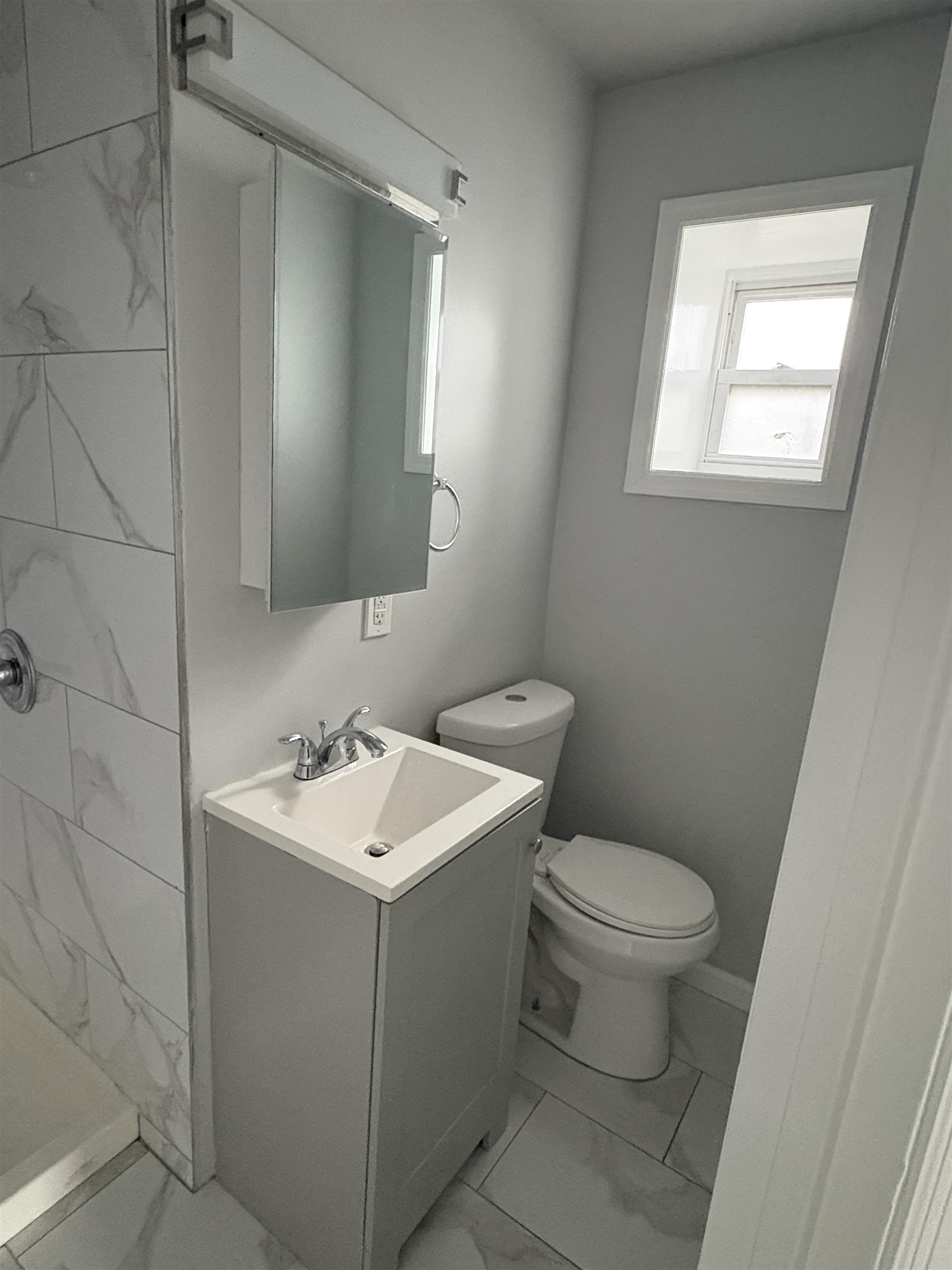 17 Teaneck Road, Unit 3A Ridgefield Park, NJ 07660 - Photo 3 of 8 a bathroom with a toilet sink and mirror