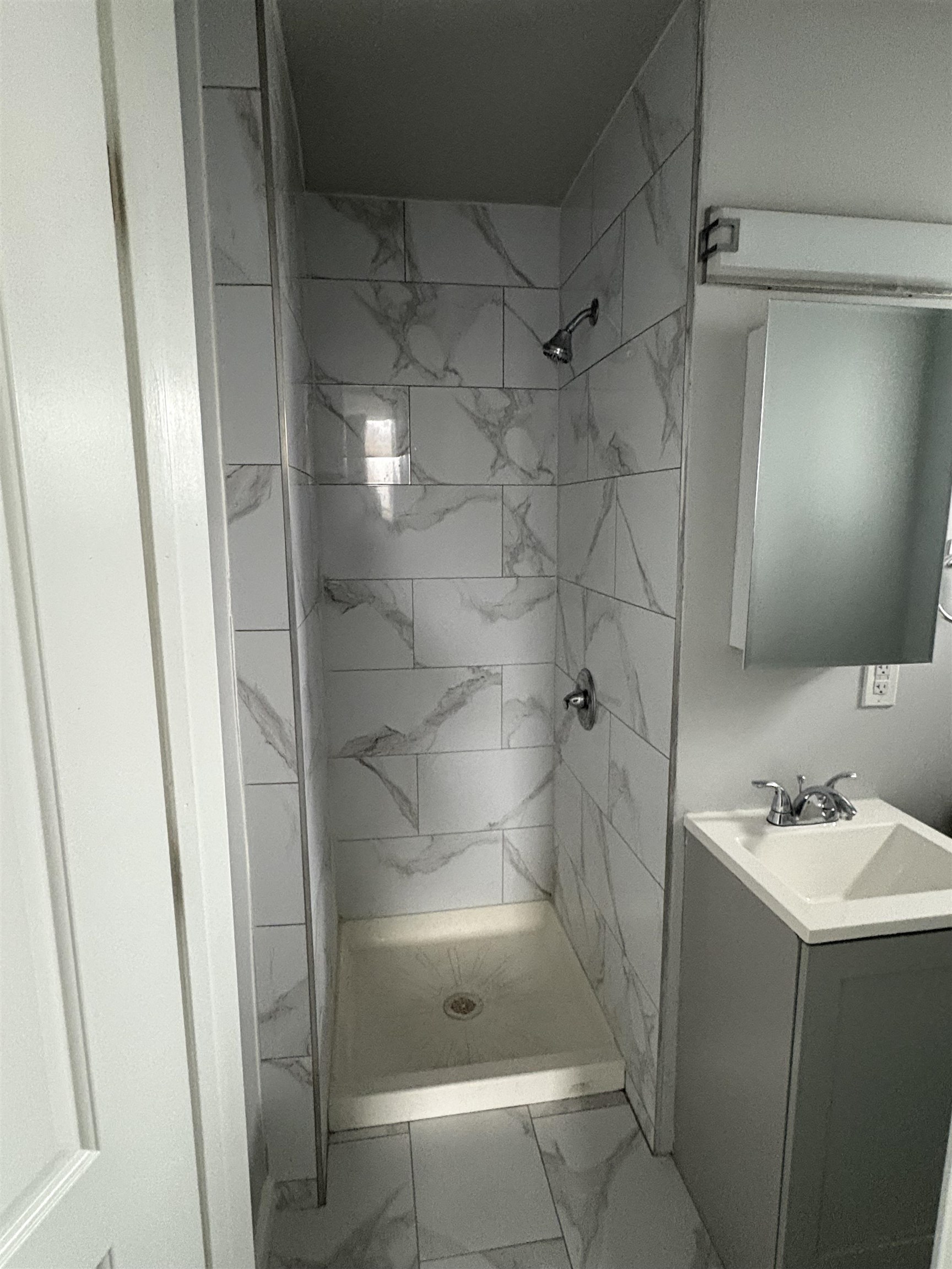 17 Teaneck Road, Unit 3A Ridgefield Park, NJ 07660 - Photo 4 of 8 a bathroom with a shower and a sink