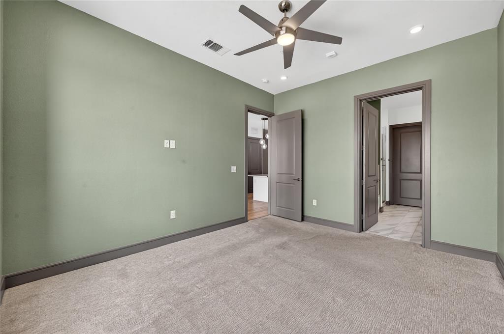 2700 Old Denton Road, Unit 2259 Carrollton, TX 75007 - Photo 20 of 39 an empty room with closet and a chandelier fan