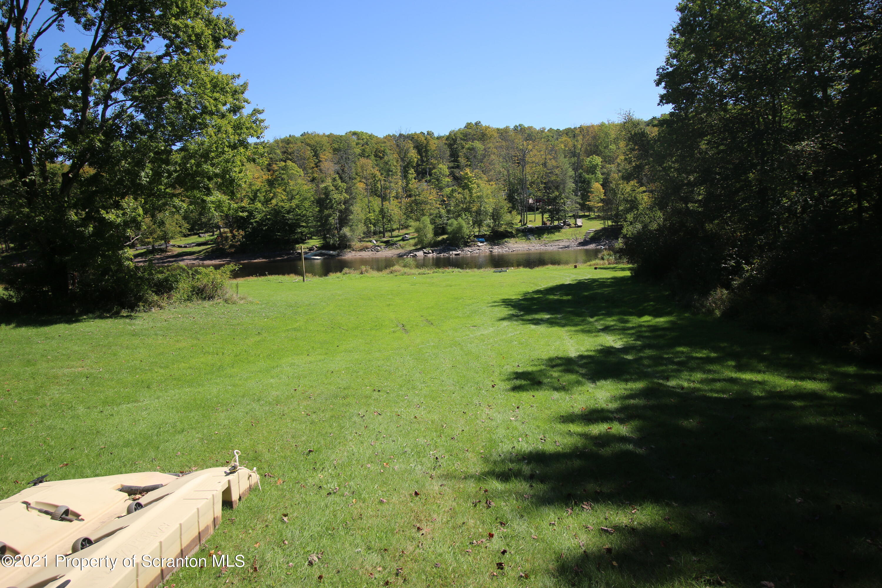 a view of a grassy area with an trees