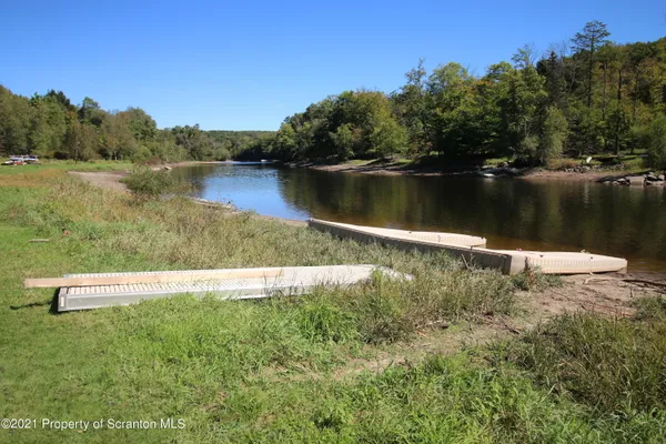a view of lake with a house in the background