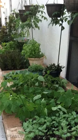 a view of a backyard with sitting area