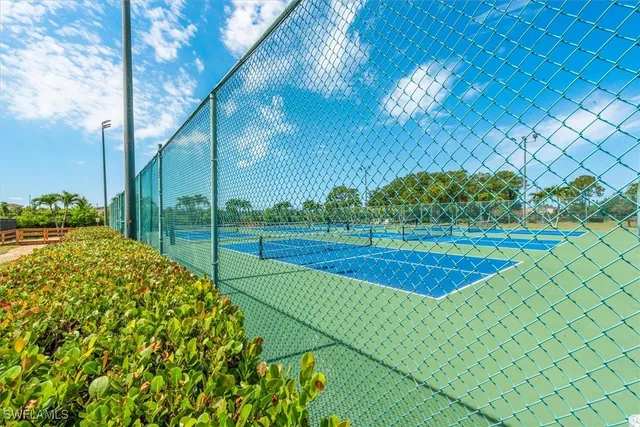 a view of a swimming pool and lounge chairs