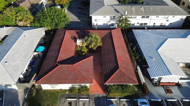 an aerial view of a house with a swimming pool yard and outdoor seating