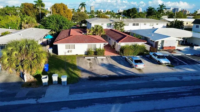 an aerial view of a house with outdoor space