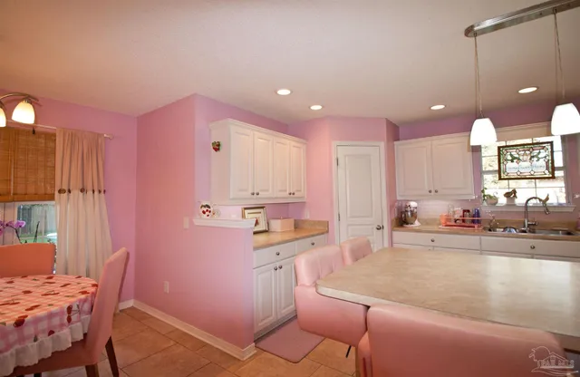 a kitchen with a sink and cabinets