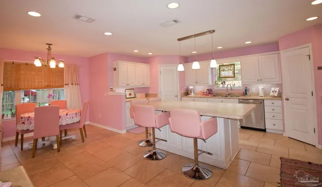 a kitchen with cabinets and window