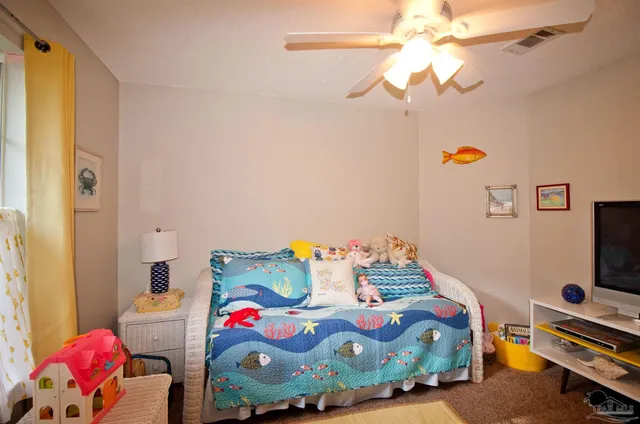 a white toilet sitting next to a shower curtain