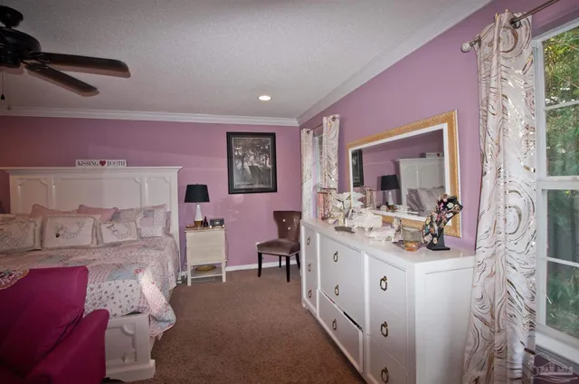 a white toilet sitting next to a shower curtain
