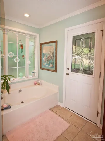 a building outdoor space with patio furniture and potted plants