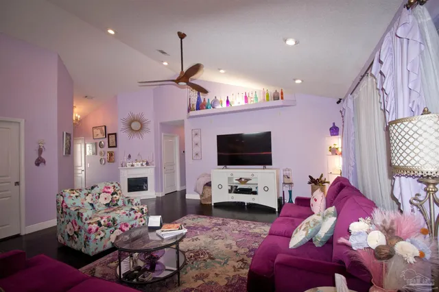 a living room with furniture and a flat screen tv