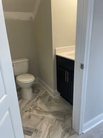 a bathroom with a toilet and a sink