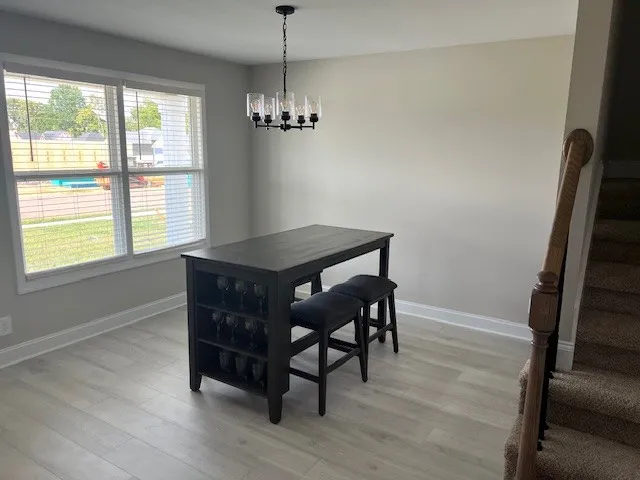 a workspace with furniture window and wooden floor