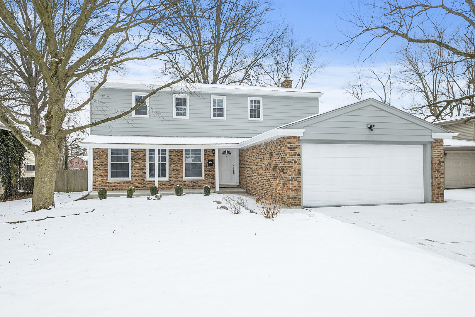 2907 Willow Road Homewood, IL 60430 - Photo 21 of 21 a front view of a house with a yard covered in snow